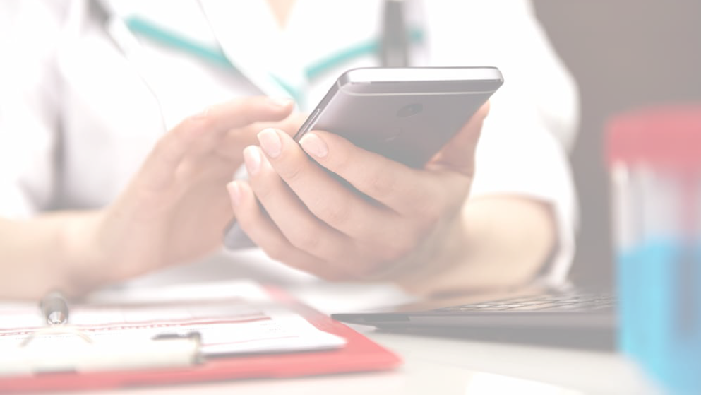 healthcare professional looking at phone, stock image with white transparent overlay